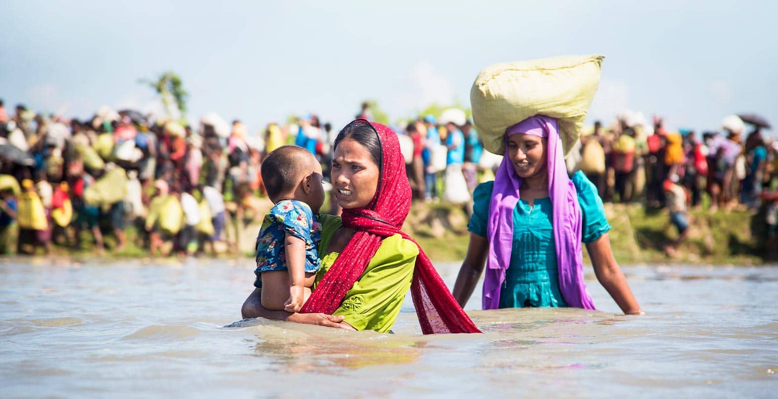 lady refugees fleeing in water