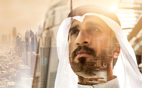 Digital composite of Middle Eastern businessman looking ahead contemplatively and a sprawling city
