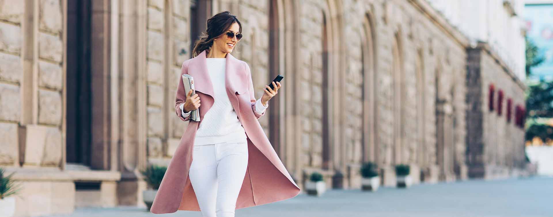 Smartly dressed woman in pink coat