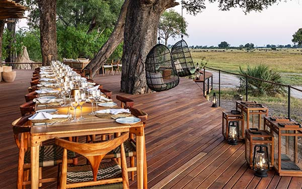 Table set on the balcony of a luxury safari loge