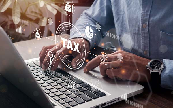 Man working at laptop computer with graphic overlay