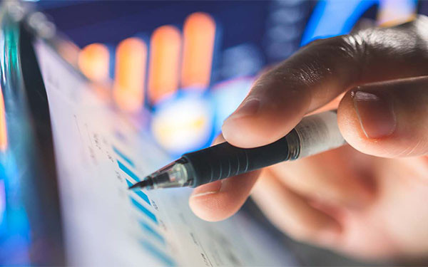 Finance consulting investing financial data displayed on a touchscreen interface, emphasizing the speed and accuracy required for effective investment planning