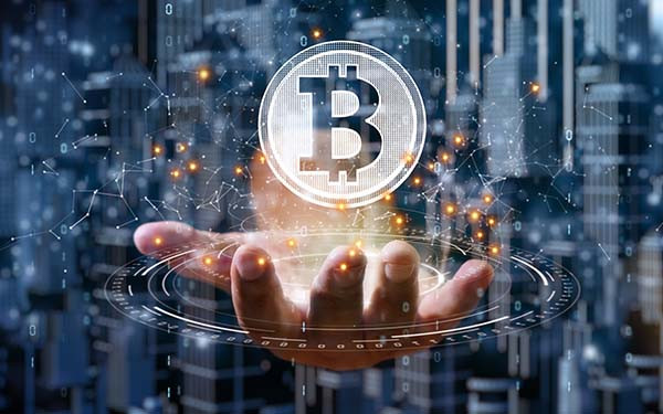 Businessman is holding a bitcoin as part of a business network, Cryptocurrency blockchain connection, Technology and financial investment background concept.