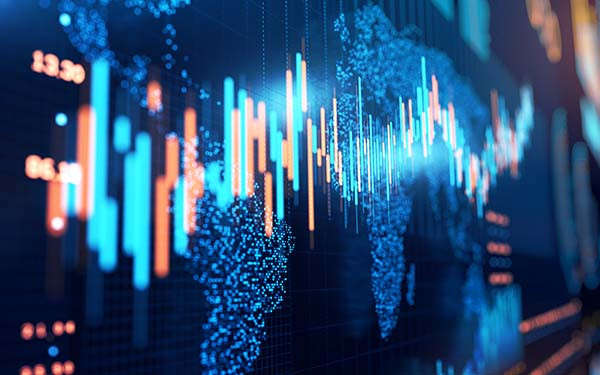 close-up of stock market chart on a glowing particle world map and trading board