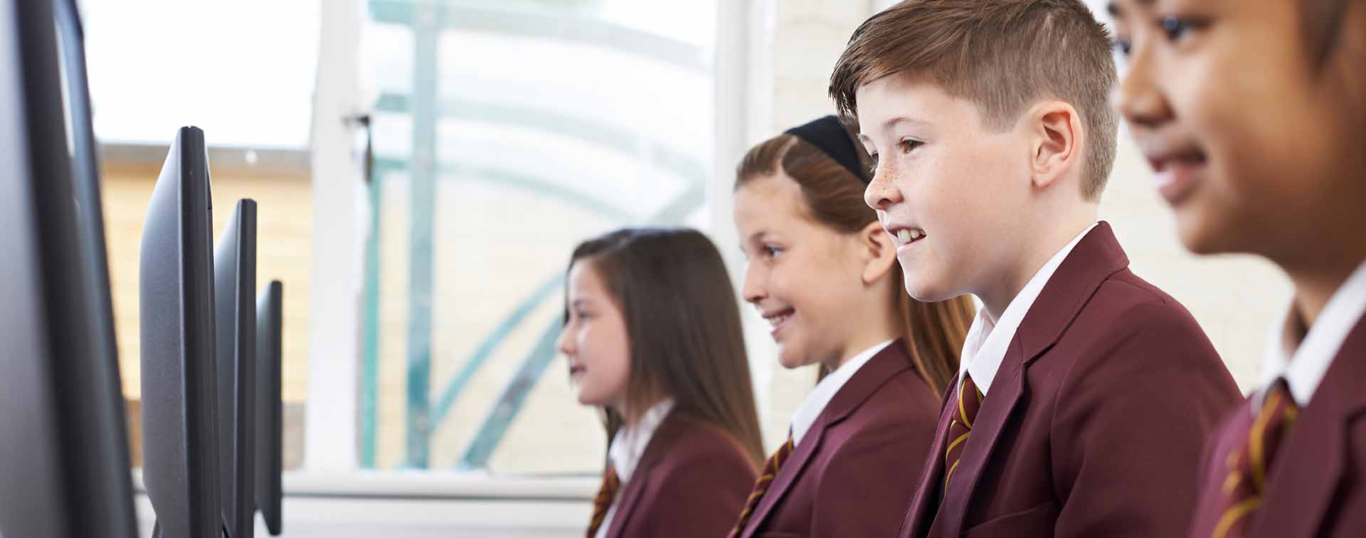 Students using computers in a classroom