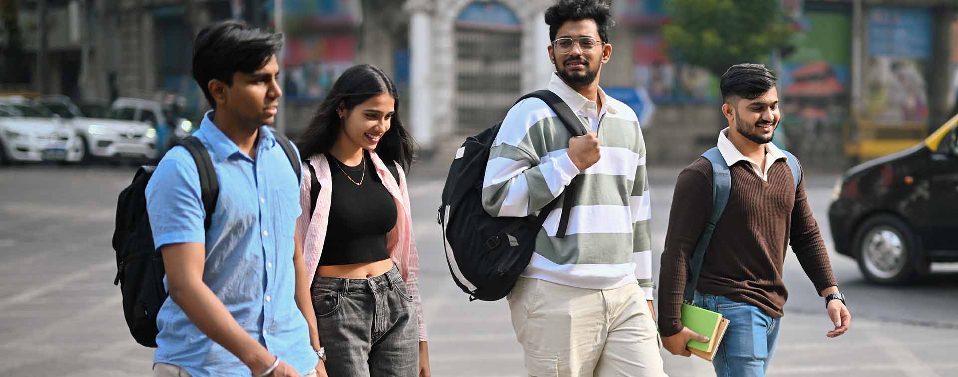 University students walking outdoors with backpacks