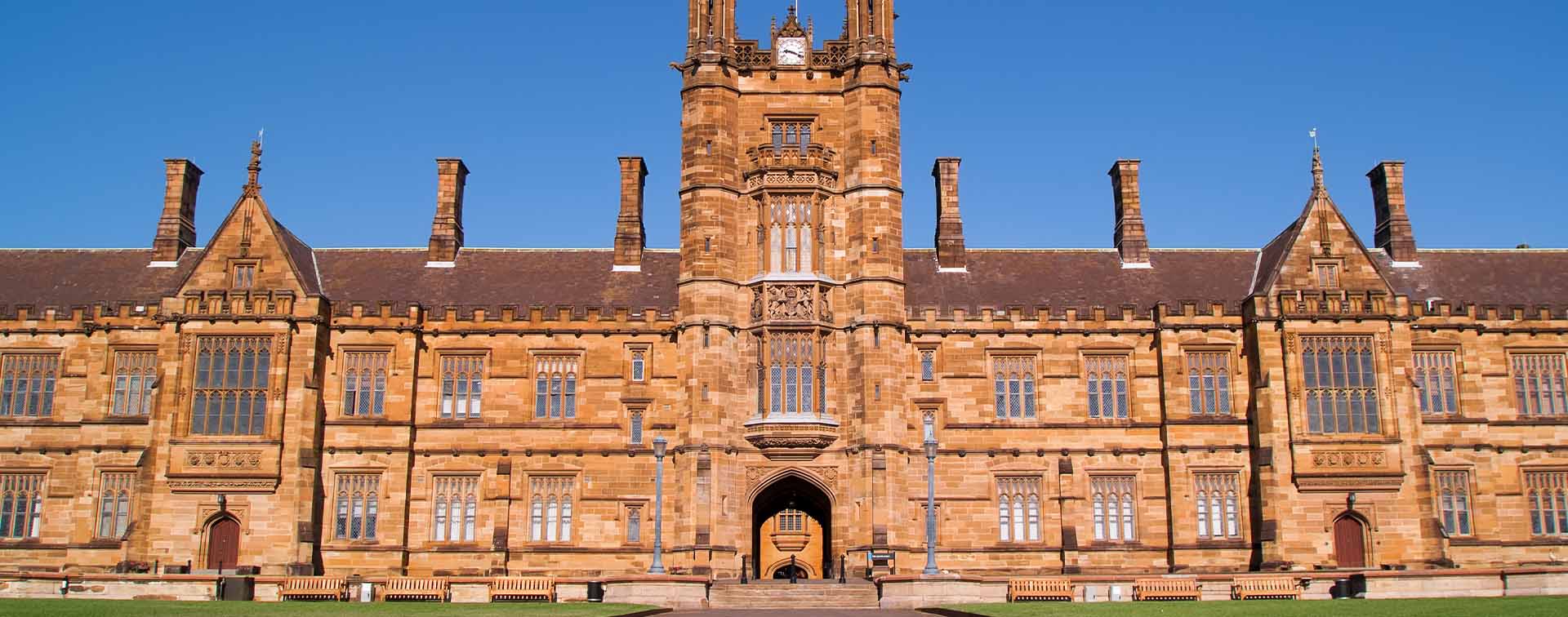 Large historic university building with central tower