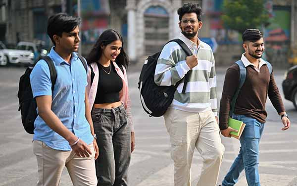 University students walking outdoors with backpacks