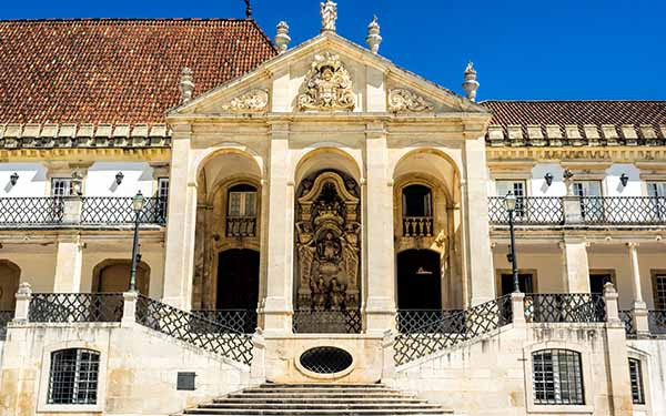 Historic university building with ornate architecture and tiled roof