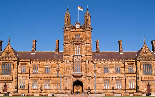 Large historic university building with central tower