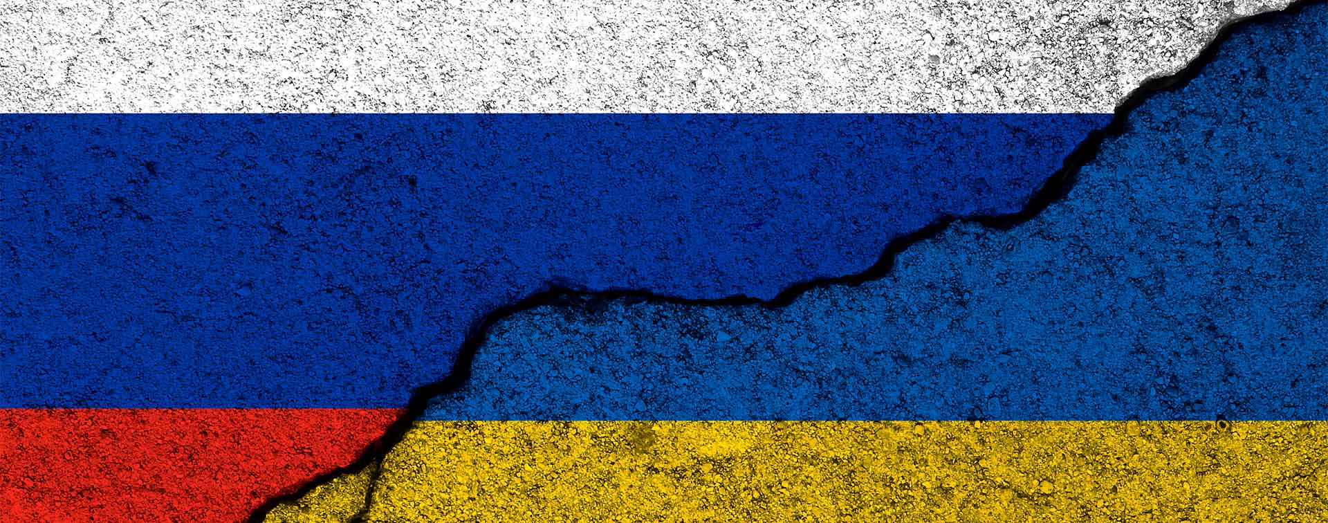 Cracking concrete with a Russian flag overlay cracking to reveal a Ukranian flag underneath.
