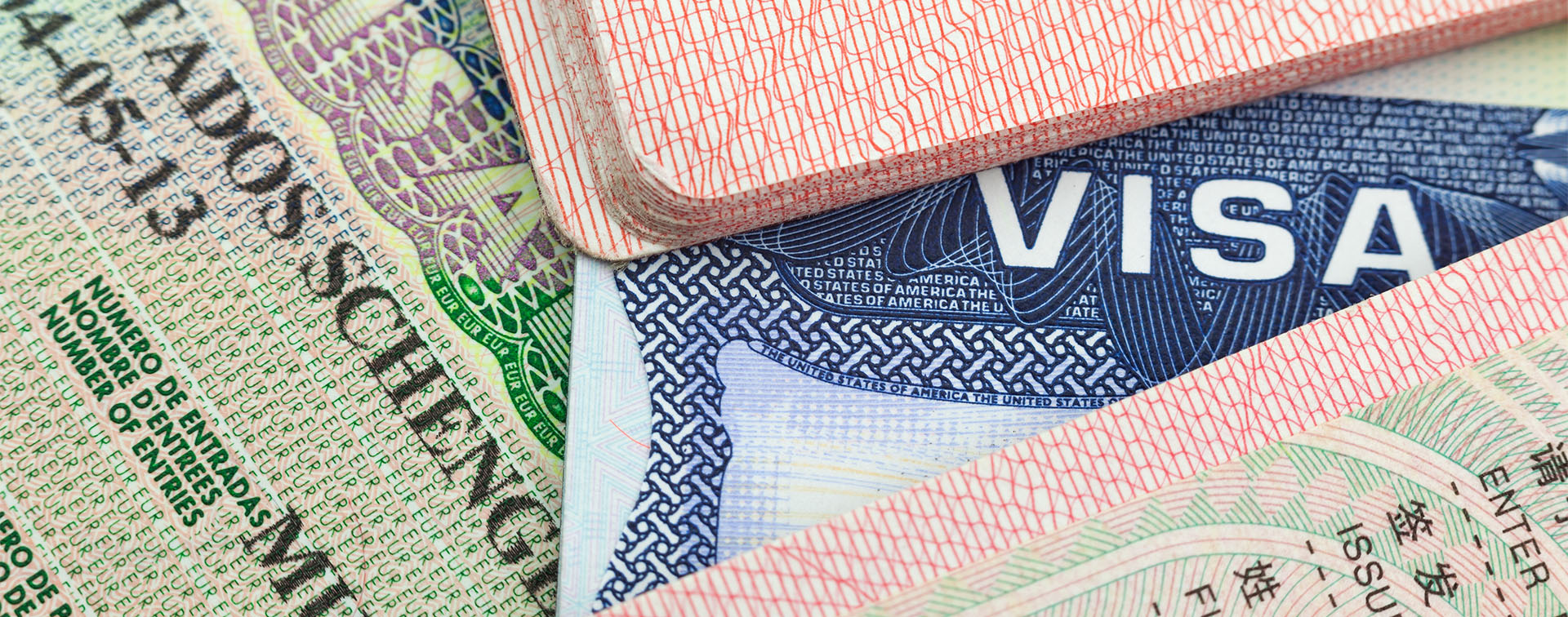 Chinese, US, and European Schengen visas in passports