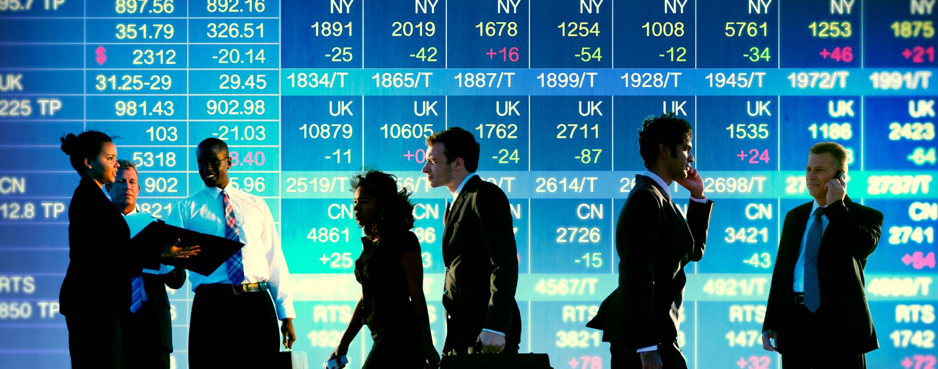 Stock exchange trading floor with business traders in suits betting on international markets