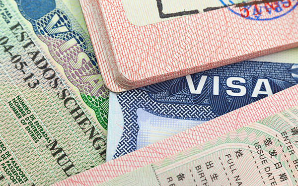 Chinese, US, and European Schengen visas in passports