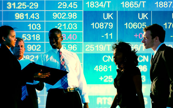 Stock exchange trading floor with business traders in suits betting on international markets