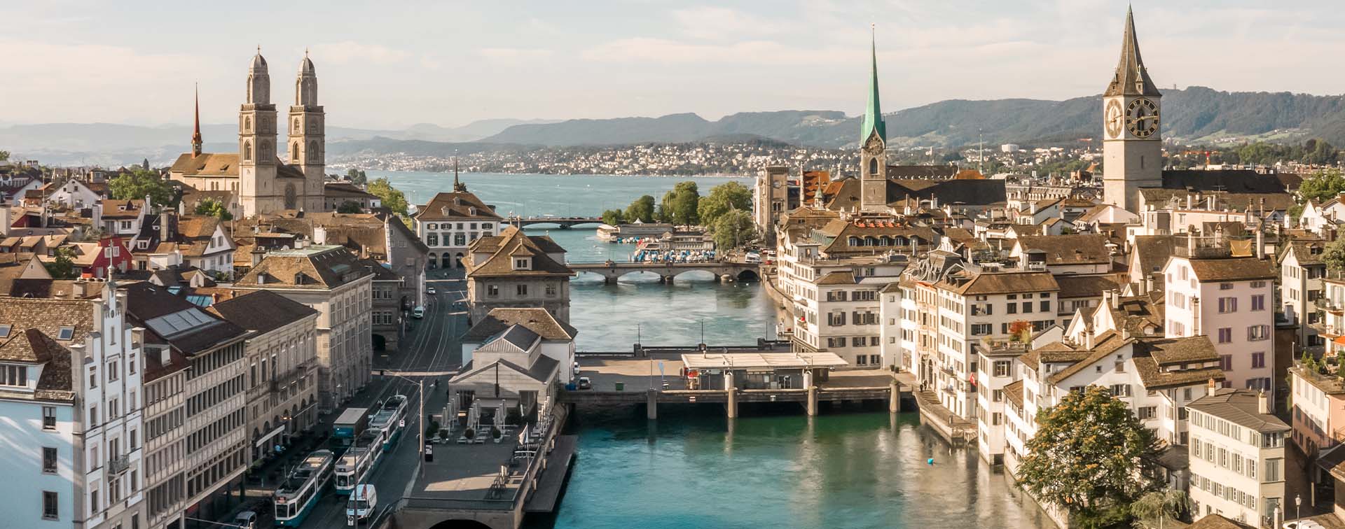Skyline of Zurich old town by the Limmat river on a sunny summer day in Switzerland