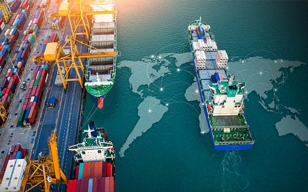 Aerial top view containers ship cargo business commercial trade logistic and transportation of international import export by container freight cargo ship with on world map