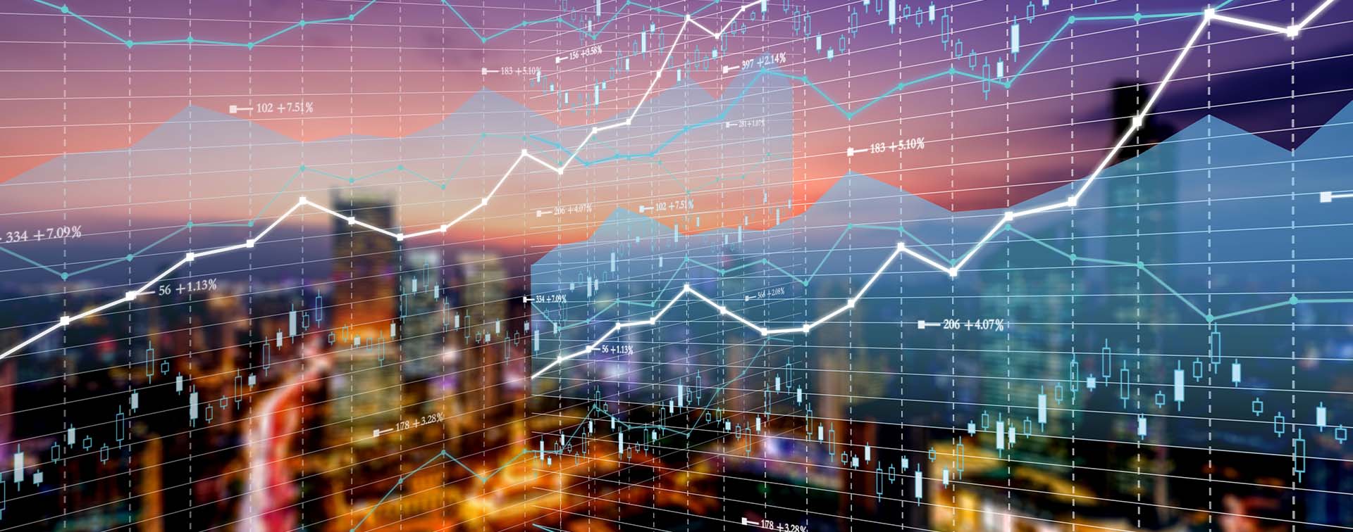 Double exposure business technology and abstract financial charts in sky on city background. Business information concept