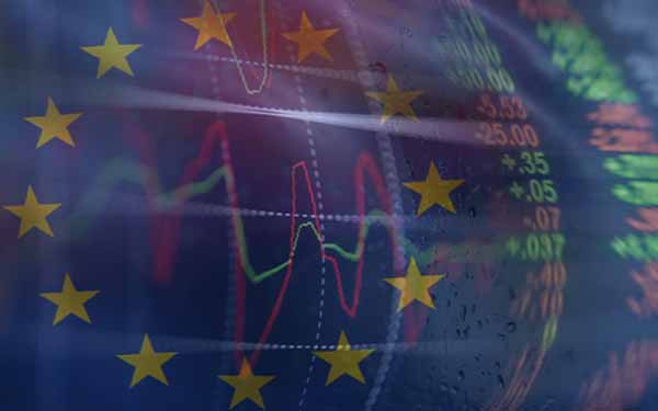 European Union flag with overlay of red and green stock market graphics. Europe, USA, World Economy, Wall Street and NY stock exchange have been under a lot of pressure