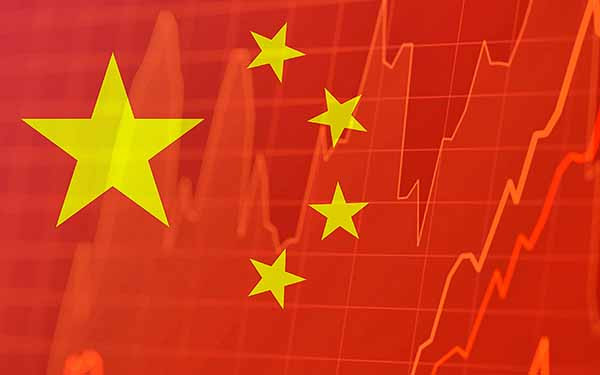 - Chinese flag and stock market indicators - concept of Chinese economic trends