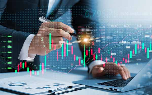 Investors use laptops to analyze stock market, investment strategies. and business growth analysis