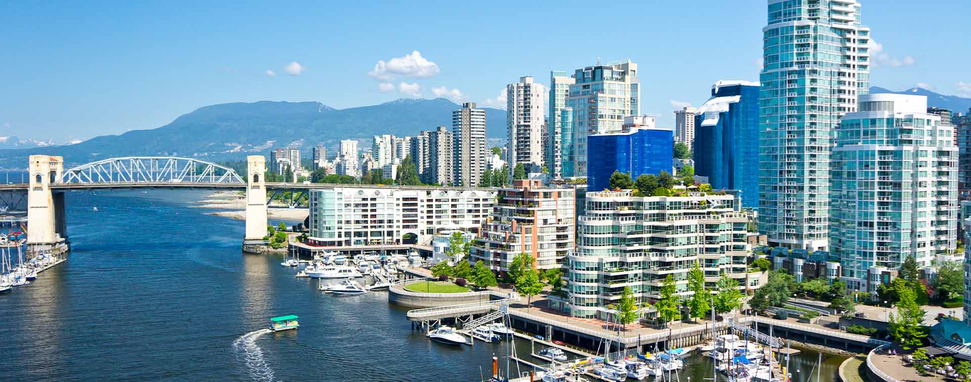 View of Vancouver, Canada, with boats in a harbor and buildings behind it