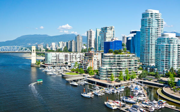 View of Vancouver, Canada, with boats in a harbor and buildings behind it