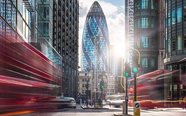 Fast-moving traffic on the streets of London’s financial district