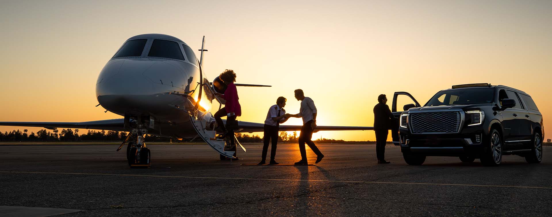 Pilot Welcoming Passengers onto Private Jet