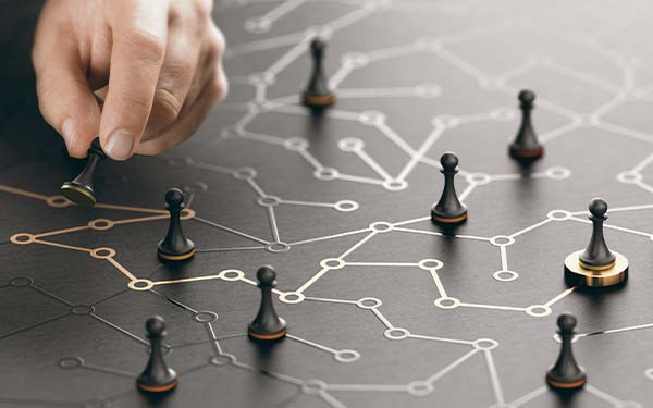 Hand moving pawn on a conceptual maze. Shortcut to success or career guidance concept