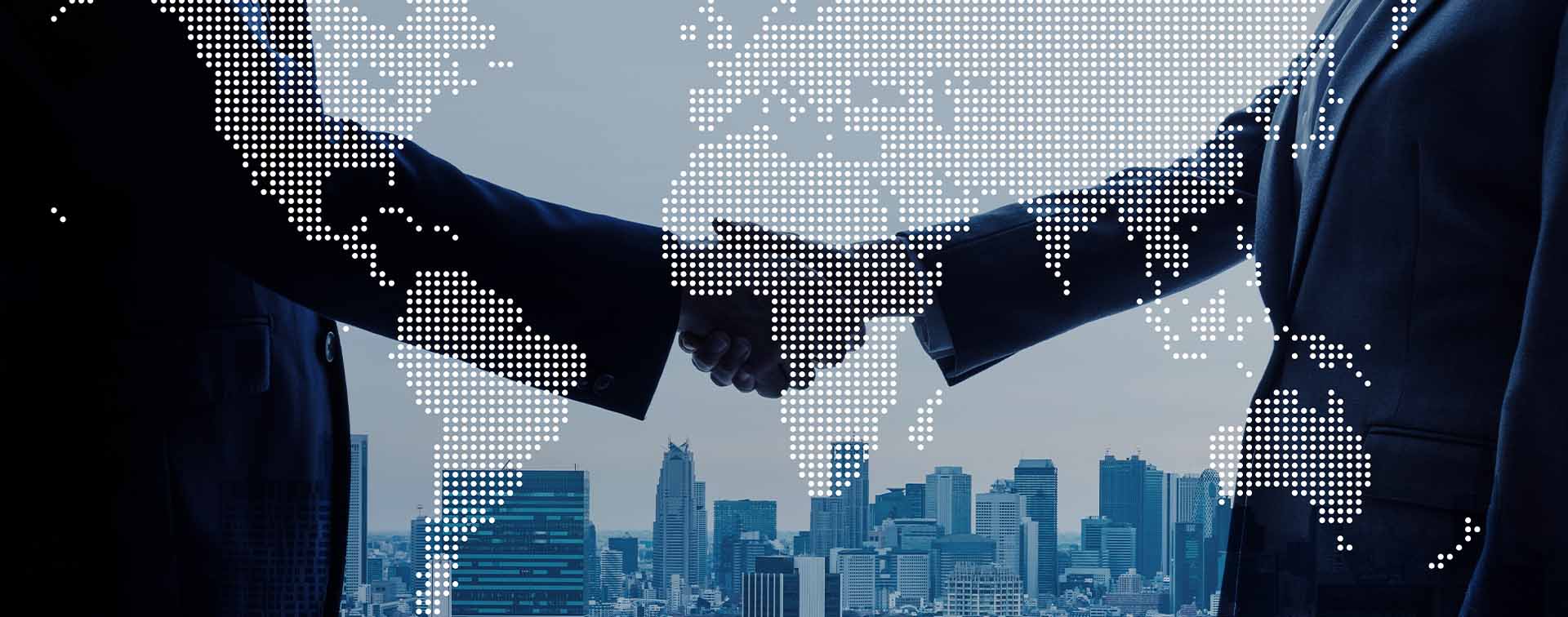 Businesspeople shaking hands with world map superimposed and cityscape in the background