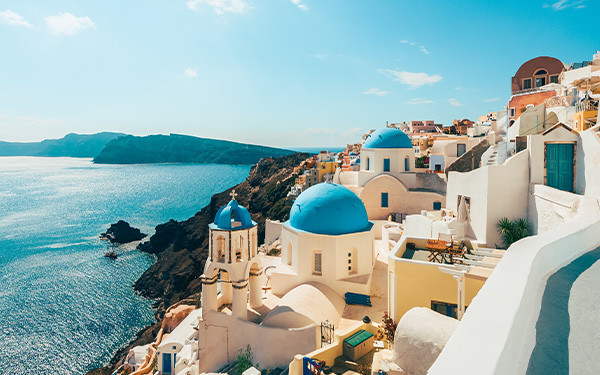 Scenic view of whitewashed buildings overlooking the ocean in Santorini, Greece